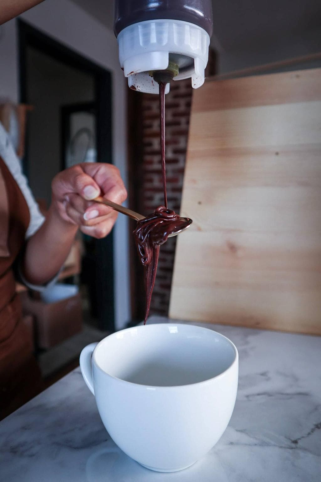 Liquid cocoa from Rebel Chocolates being poured..