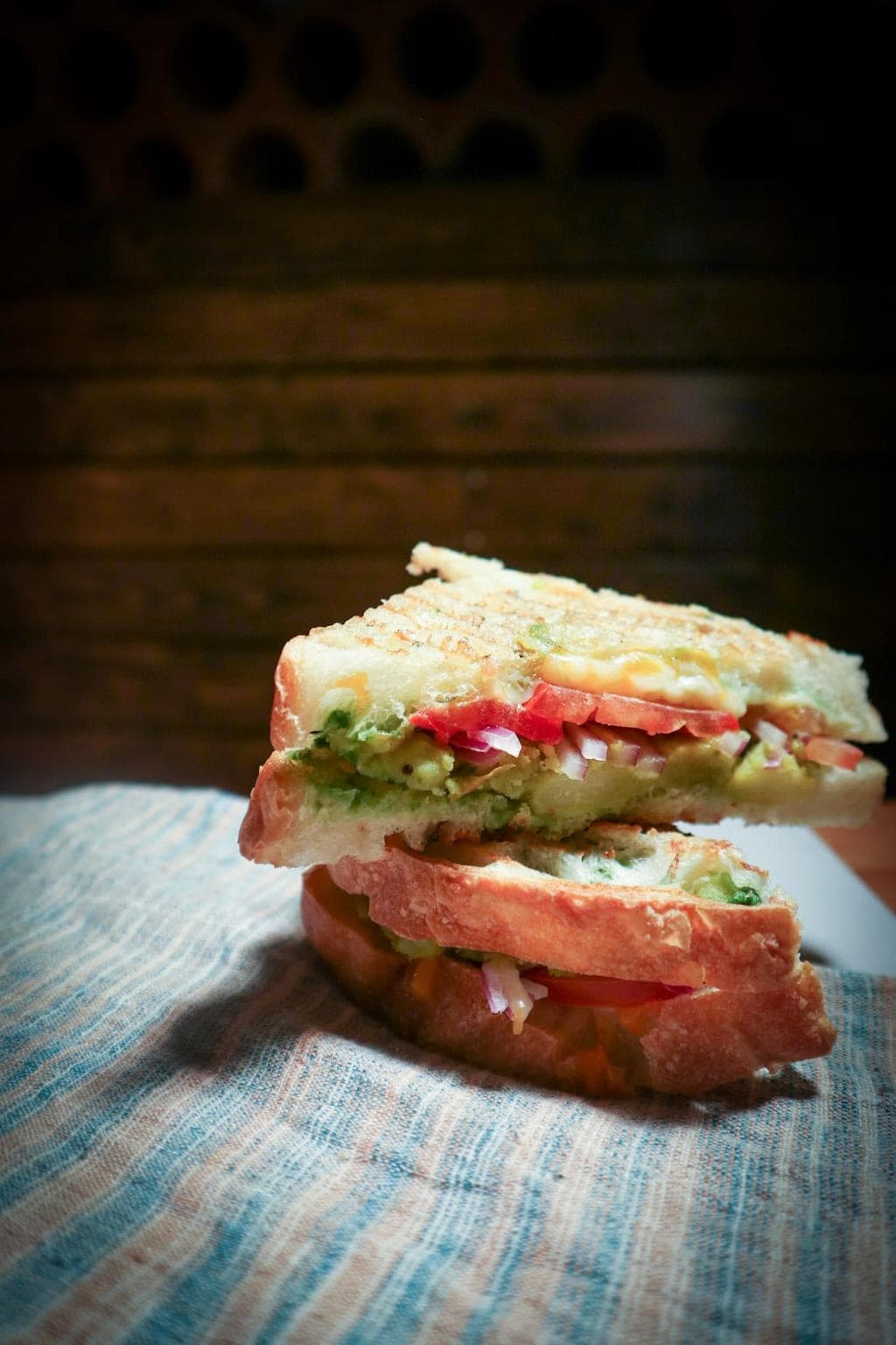 A masala melt sandwich cut in half.